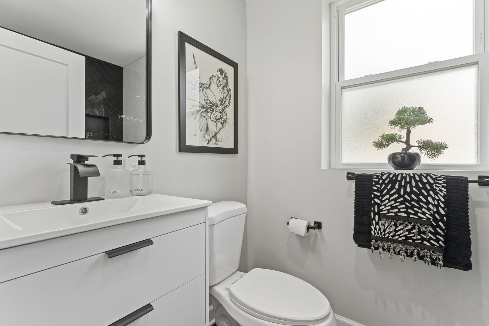 8746 South Wood Street Chicago, IL 60620 - Photo 13 of 27 a bathroom with a sink toilet and mirror