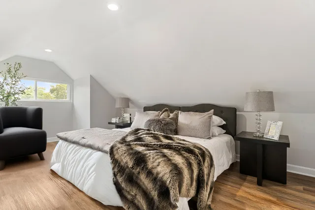 a bed room with a bed and a couch