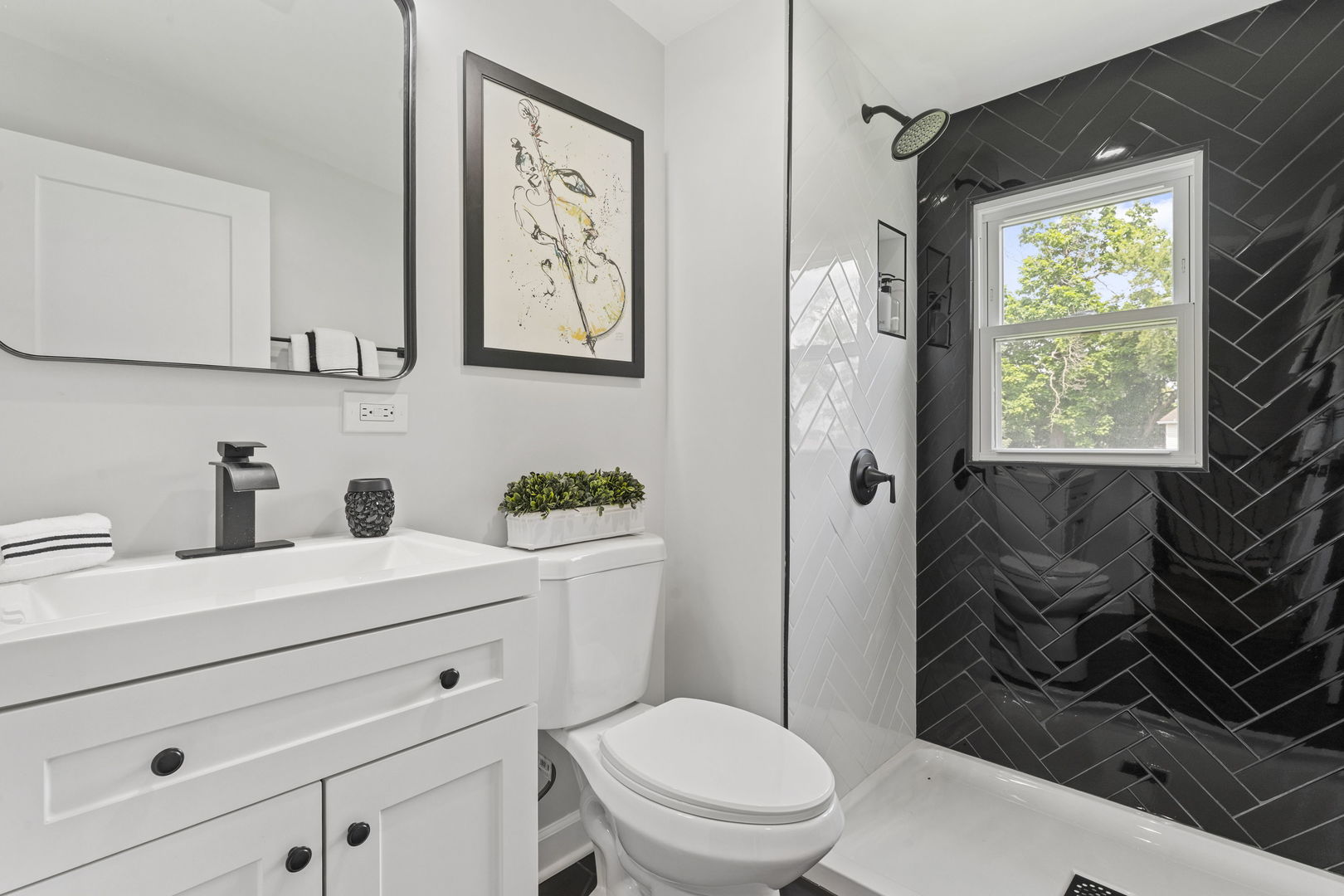 8746 South Wood Street Chicago, IL 60620 - Photo 17 of 27 a bathroom with a toilet sink and mirror