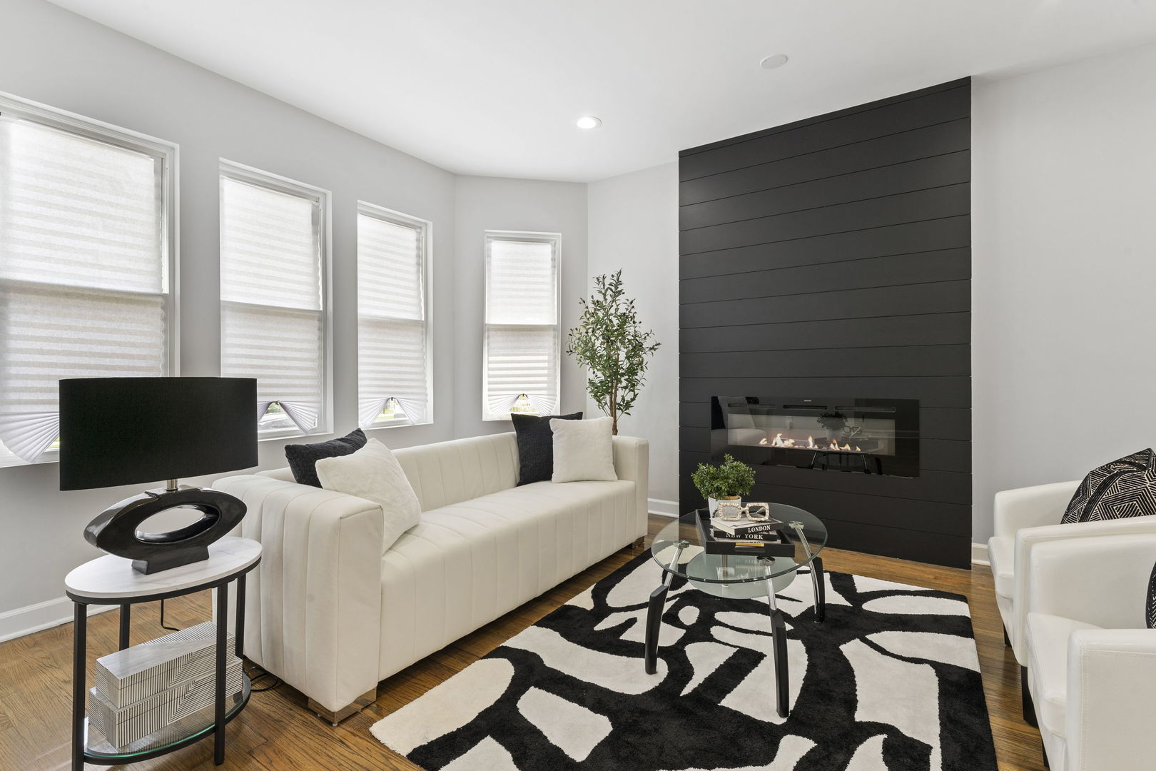 8746 South Wood Street Chicago, IL 60620 - Photo 2 of 27 a living room with furniture and a flat screen tv