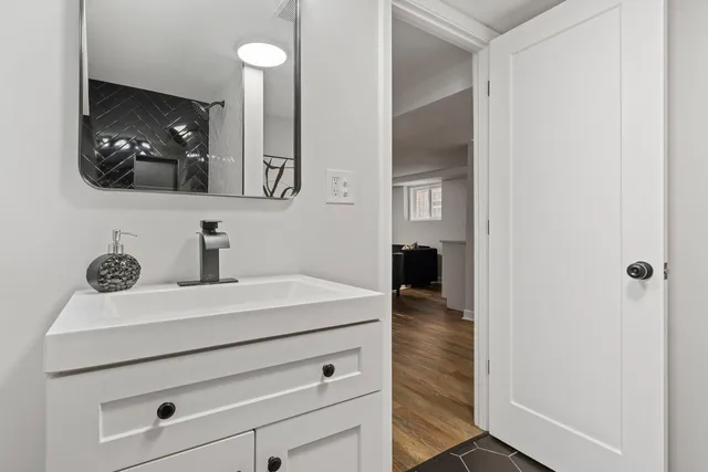 a bathroom with a sink and a mirror