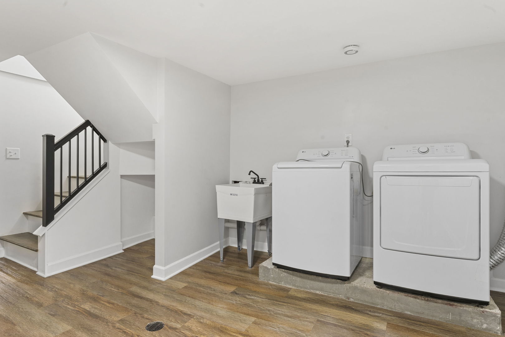 8746 South Wood Street Chicago, IL 60620 - Photo 23 of 27 a view of a utility room with washer and dryer