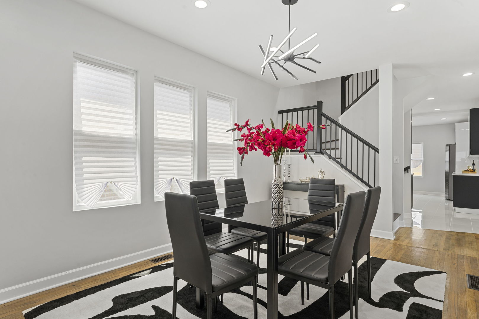 8746 South Wood Street Chicago, IL 60620 - Photo 4 of 27 a view of a dining room with furniture and wooden floor