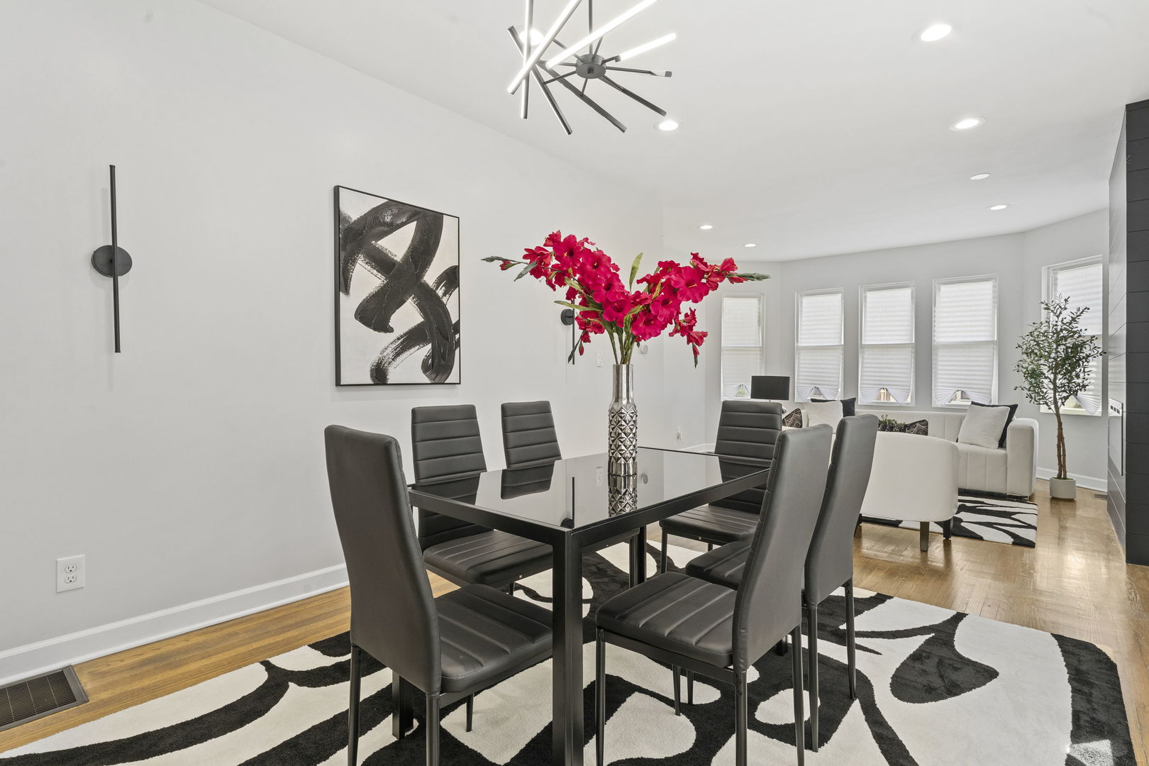 8746 South Wood Street Chicago, IL 60620 - Photo 6 of 27 a view of a dining room with furniture and wooden floor