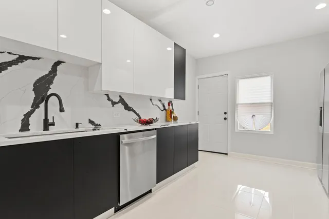 a kitchen with a sink and cabinets