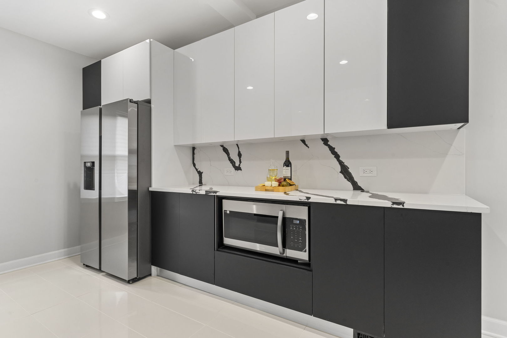 8746 South Wood Street Chicago, IL 60620 - Photo 8 of 27 a kitchen with stainless steel appliances a refrigerator and a stove