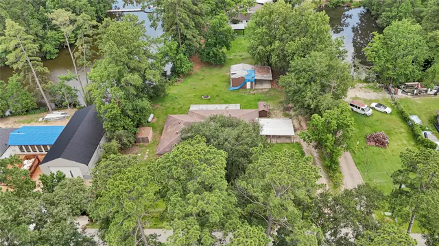 an aerial view of a house with outdoor space and street view