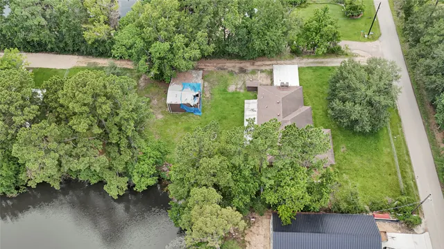 an aerial view of a house with pool yard outdoor seating and yard