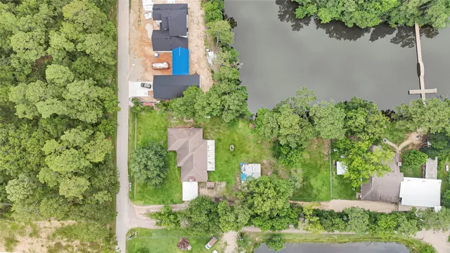 an aerial view of a house with a yard and garden
