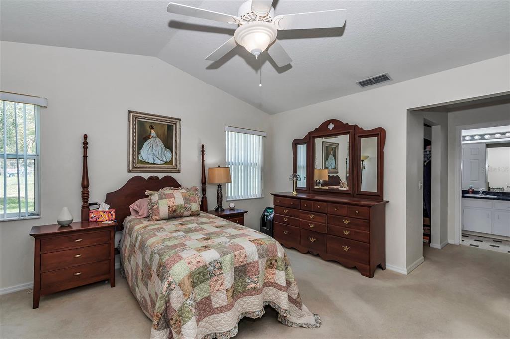 8342 Southwest 65th Avenue Ocala, FL 34476 - Photo 19 of 40 a bedroom with a bed and wooden floor