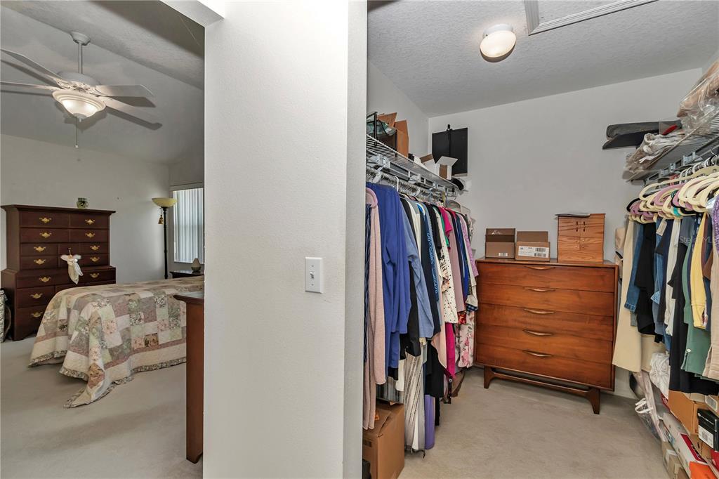 8342 Southwest 65th Avenue Ocala, FL 34476 - Photo 20 of 40 a view of walk in closet with clothes and shoes