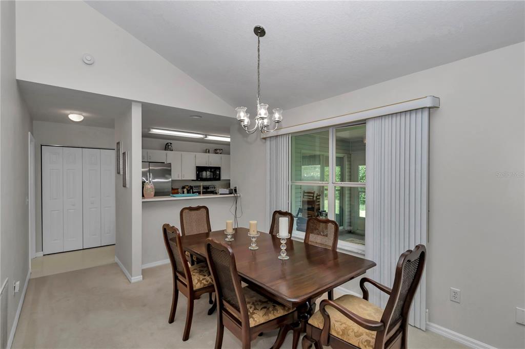 8342 Southwest 65th Avenue Ocala, FL 34476 - Photo 9 of 40 a view of a dining room with furniture window and outside view
