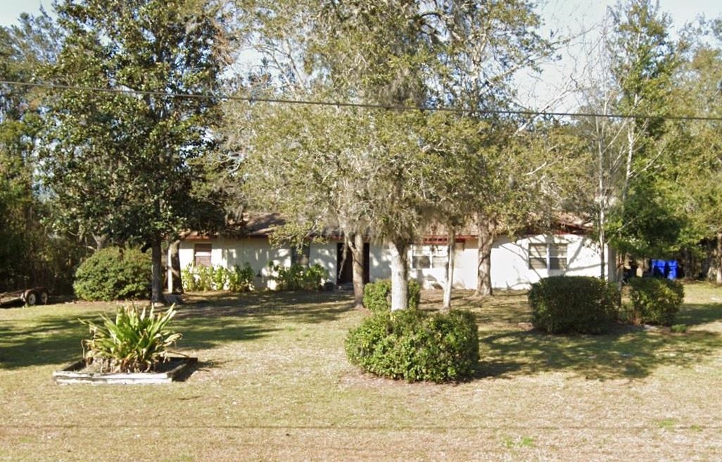 890 Oak Ridge Road St. Augustine, FL 32086 - Photo 1 of 1 a view of yard with tree