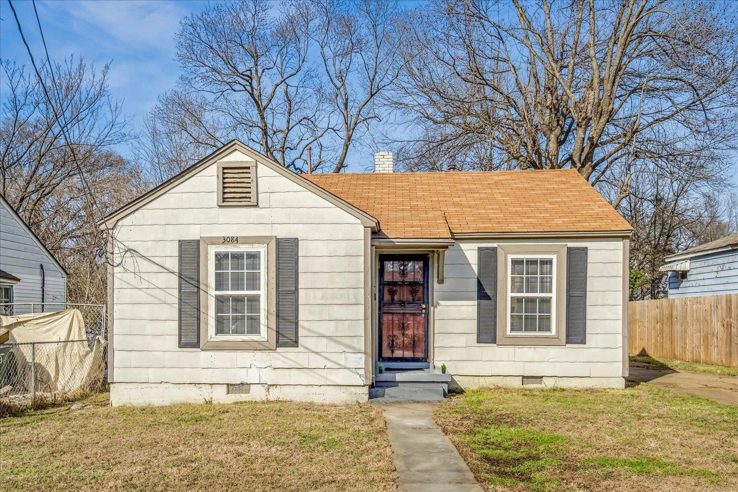 Bungalow-style house with crawl space, a chimney, and a shingled roof