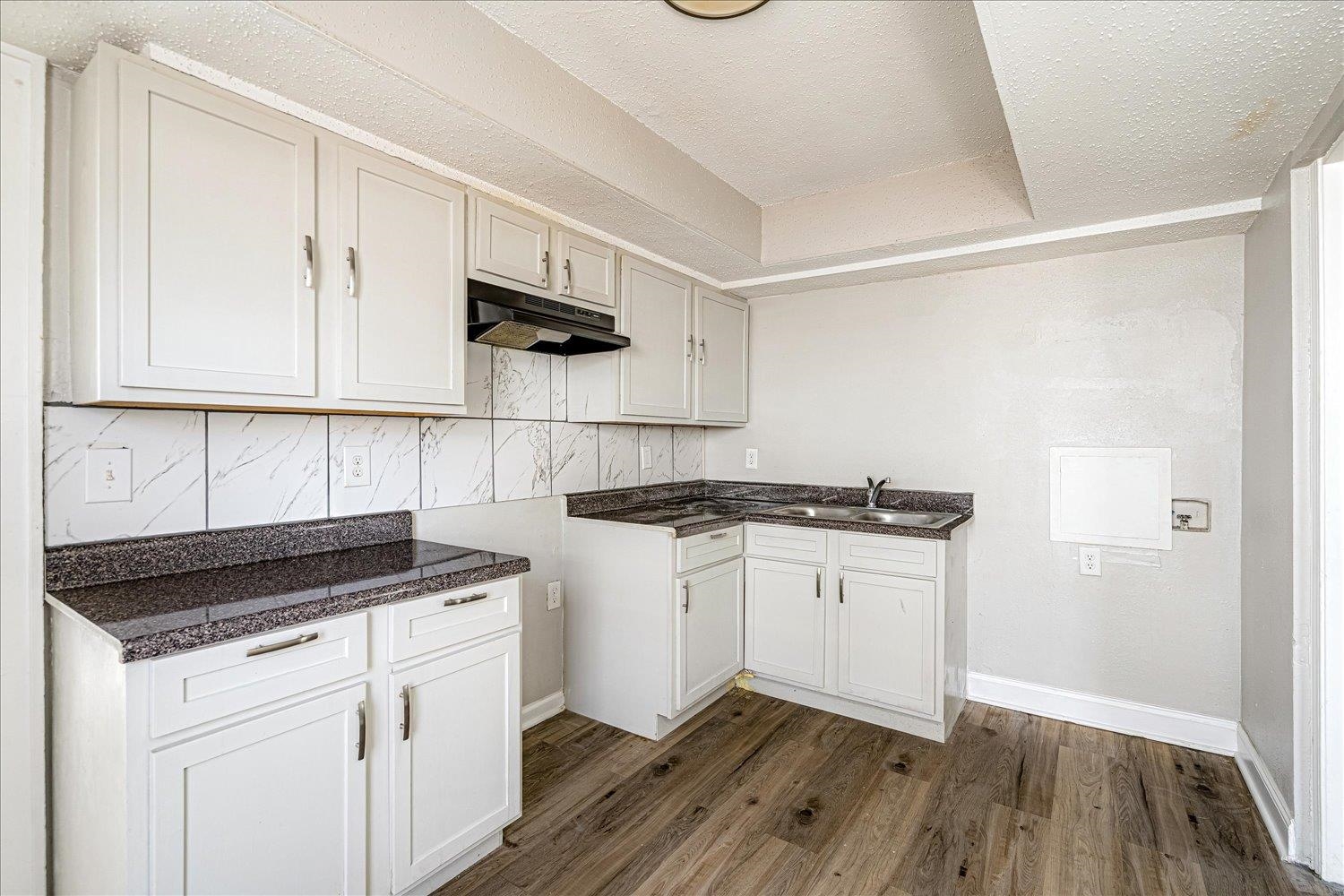 3084 Pershing Avenue Memphis, TN 38112 - Photo 14 of 30 a kitchen with granite countertop a sink cabinets and stainless steel appliances