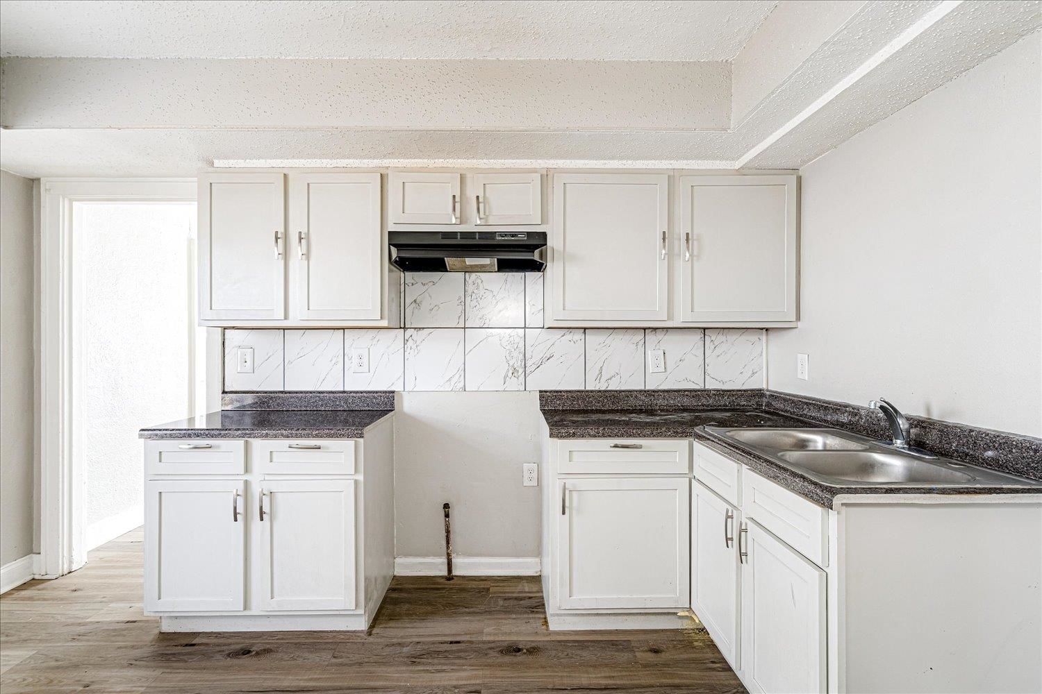 3084 Pershing Avenue Memphis, TN 38112 - Photo 15 of 30 a kitchen with granite countertop a sink and a stove