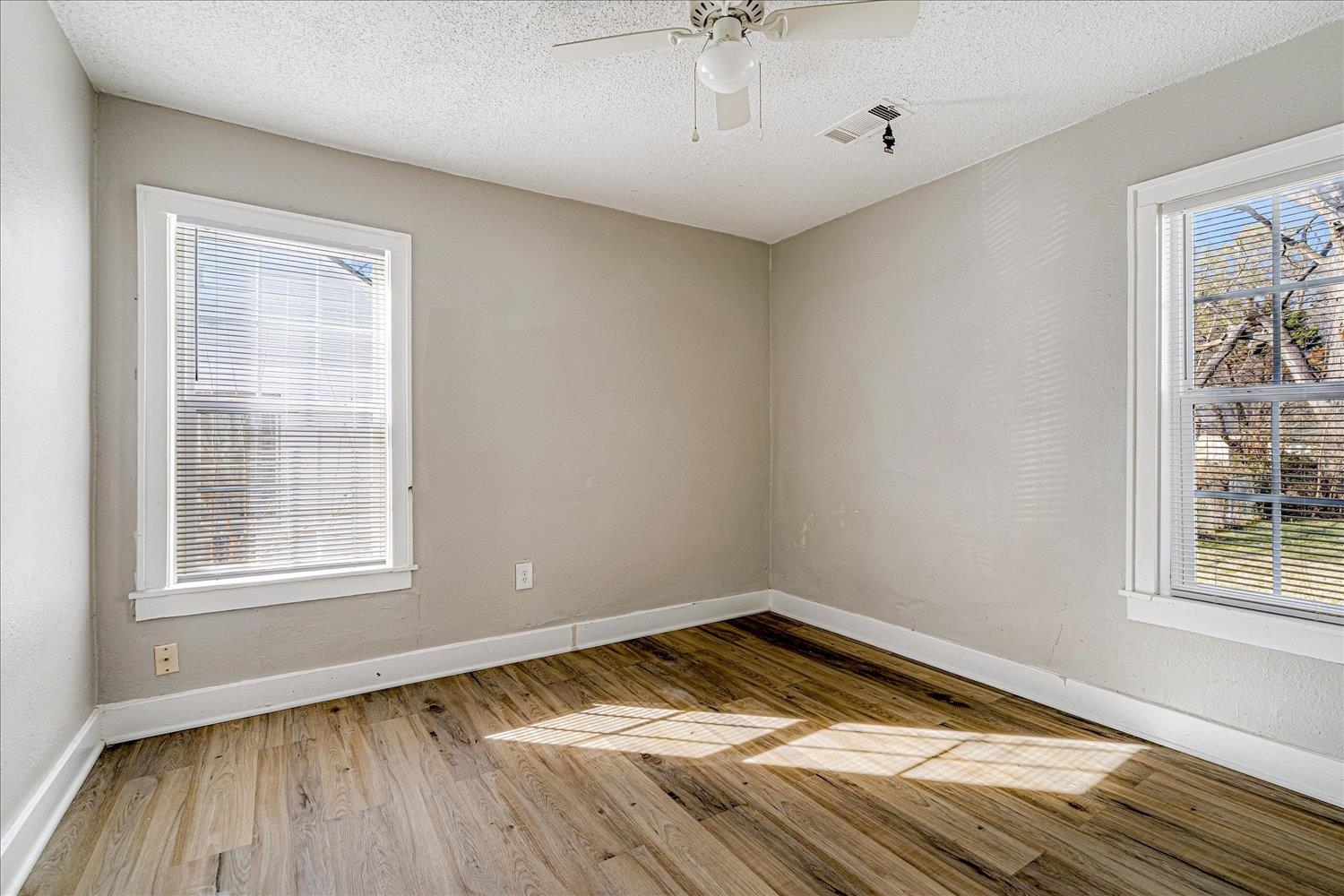 3084 Pershing Avenue Memphis, TN 38112 - Photo 24 of 30 a view of empty room with wooden floor and fan