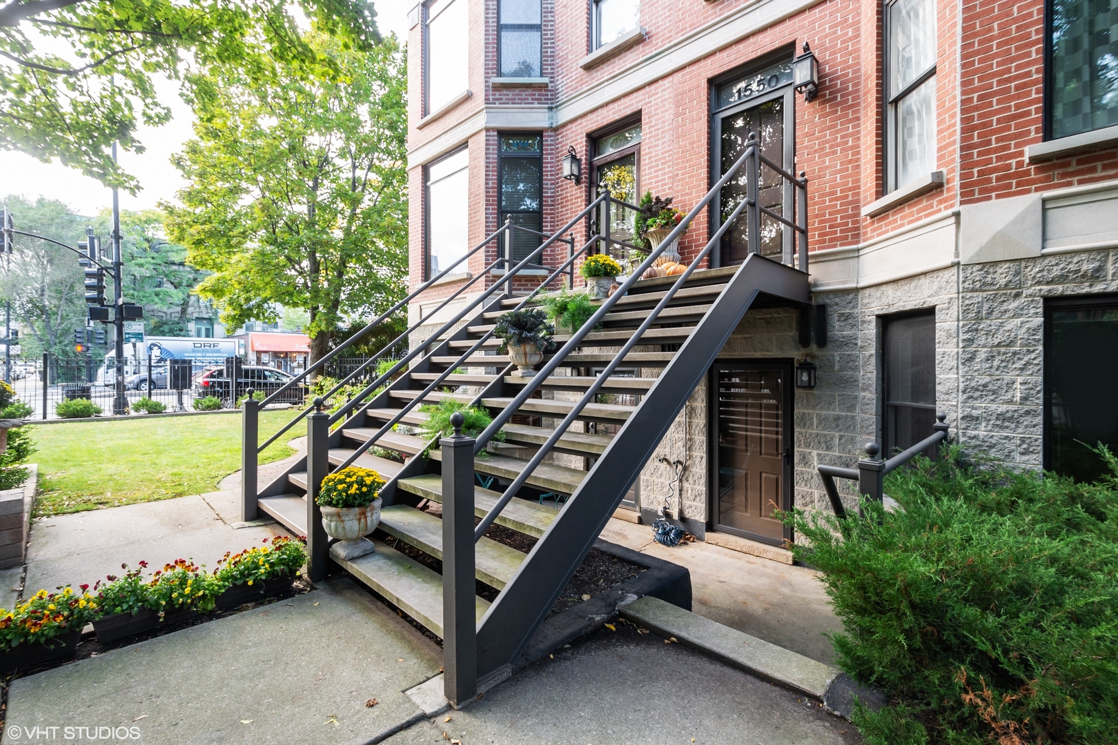 1550 West Jackson Boulevard, Unit 1 Chicago, IL 60607 - Photo 2 of 10 a front view of a house with a yard