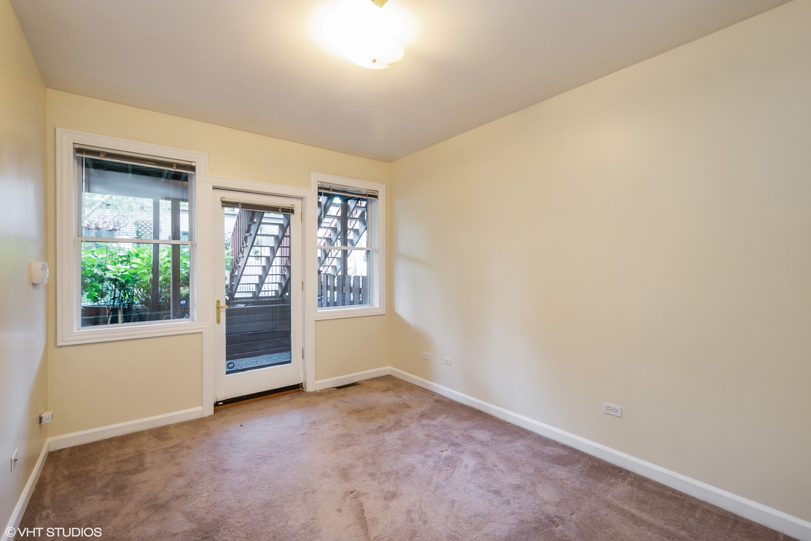 1550 West Jackson Boulevard, Unit 1 Chicago, IL 60607 - Photo 8 of 10 an empty room with windows