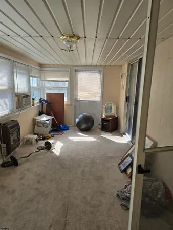 a room with gym equipment and a window
