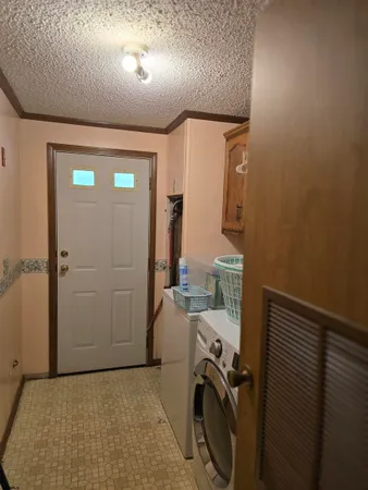 a view of a storage & utility room with utility room