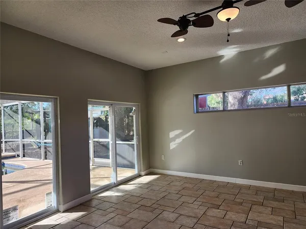 a kitchen with granite countertop a sink and a stove