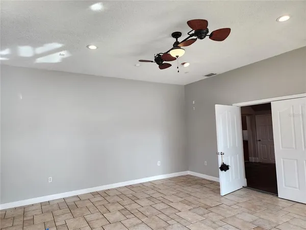 a bathroom with a granite countertop sink a toilet and shower