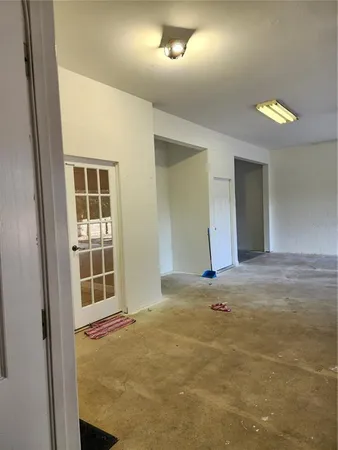 a room with a window and washer