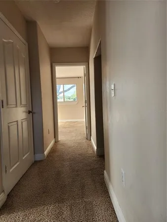 a view of empty room with windows