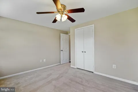 a view of an empty room with stairs