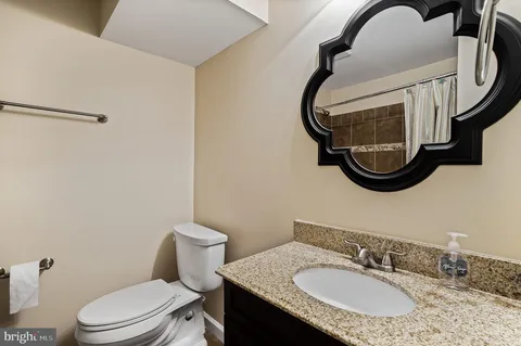 a view of backyard with a garden and deck