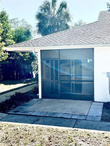 a view of backyard with potted plants