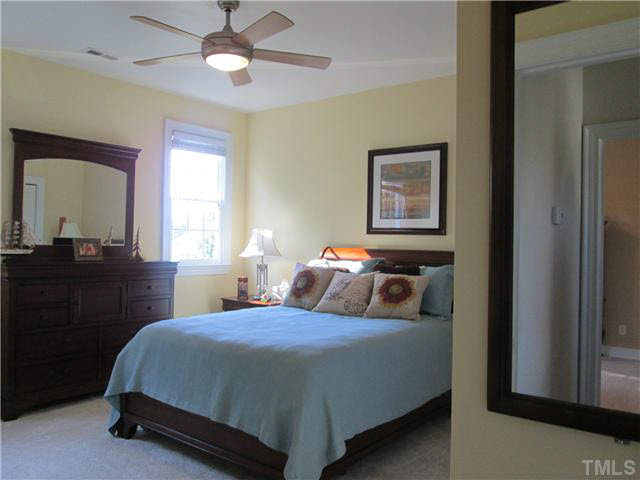 5 Chasewood Court Durham, NC 27703 - Photo 16 of 25 a bedroom with a bed and a dresser