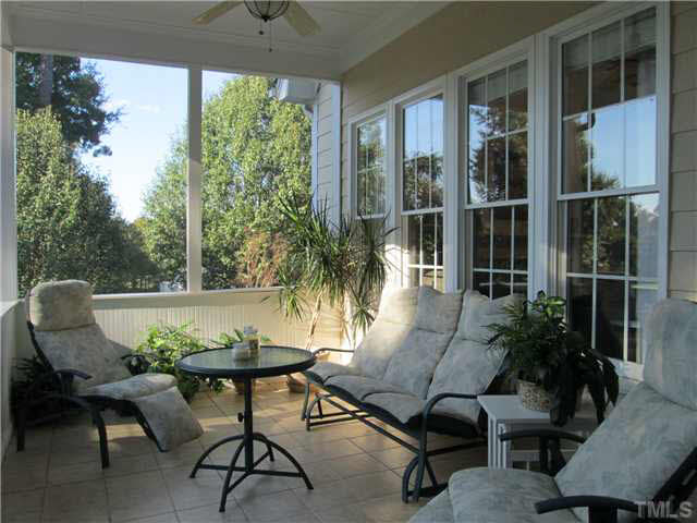 5 Chasewood Court Durham, NC 27703 - Photo 20 of 25 a view of a patio with table and chairs and potted plants