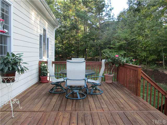 5 Chasewood Court Durham, NC 27703 - Photo 22 of 25 a view of deck with furniture and trees