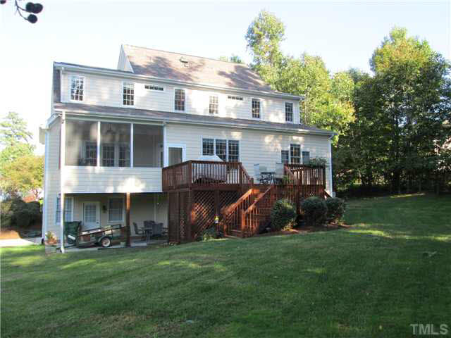 5 Chasewood Court Durham, NC 27703 - Photo 23 of 25 a view of a house with a yard and a deck