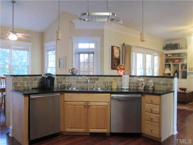 5 Chasewood Court Durham, NC 27703 - Photo 8 of 25 a kitchen with granite countertop a sink and cabinets