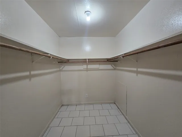 a view of a room with racks on the wall