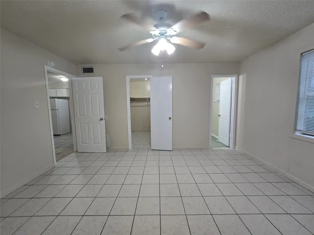 a view of an empty room and window