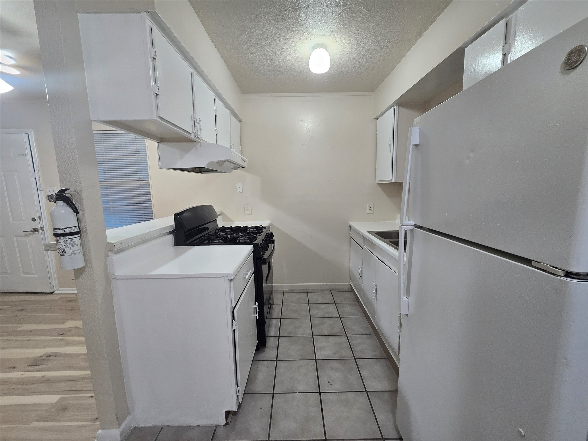 3714 Ave South, Unit 7 Galveston, TX 77550 - Photo 6 of 8 a utility room with cabinets washer and dryer