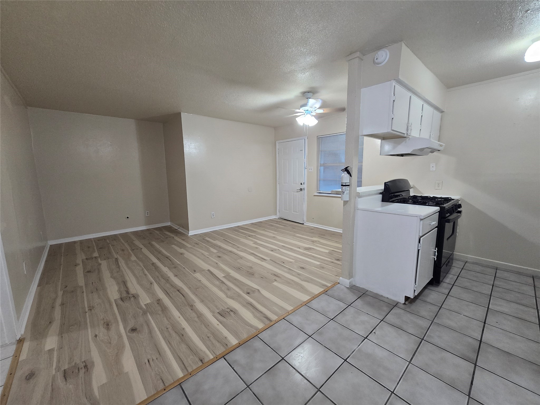 3714 Ave South, Unit 7 Galveston, TX 77550 - Photo 7 of 8 a kitchen with a sink a stove and cabinets