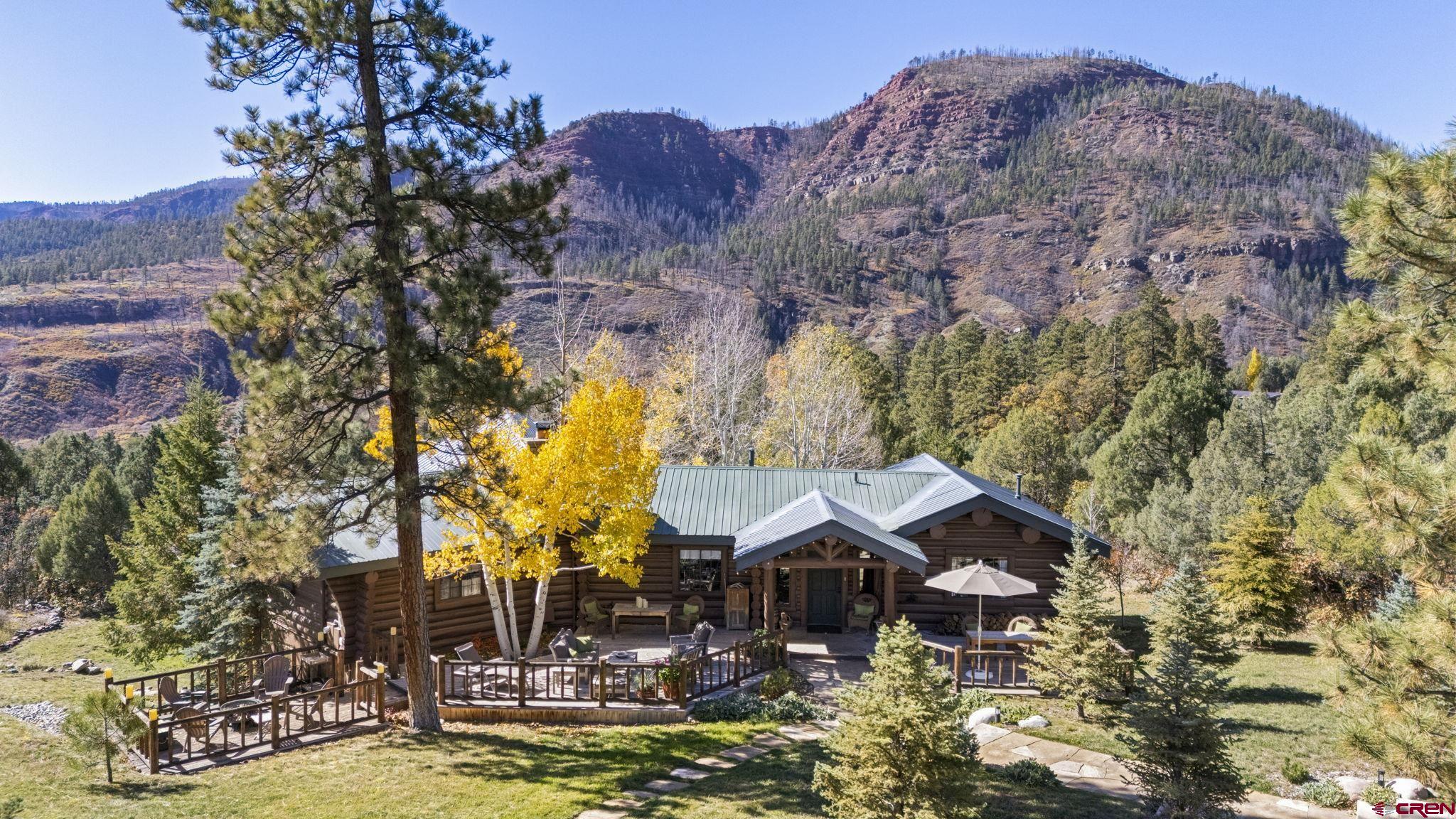 114 Rimrock Drive Durango, CO 81301 - Photo 1 of 42 a view of a house with pool and sitting area