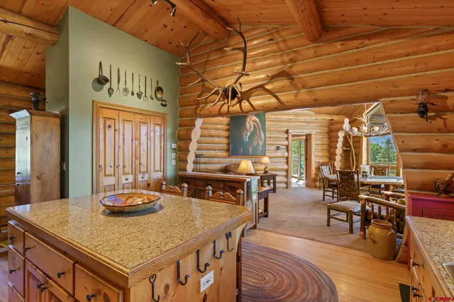 a dining table with chairs and wooden floor
