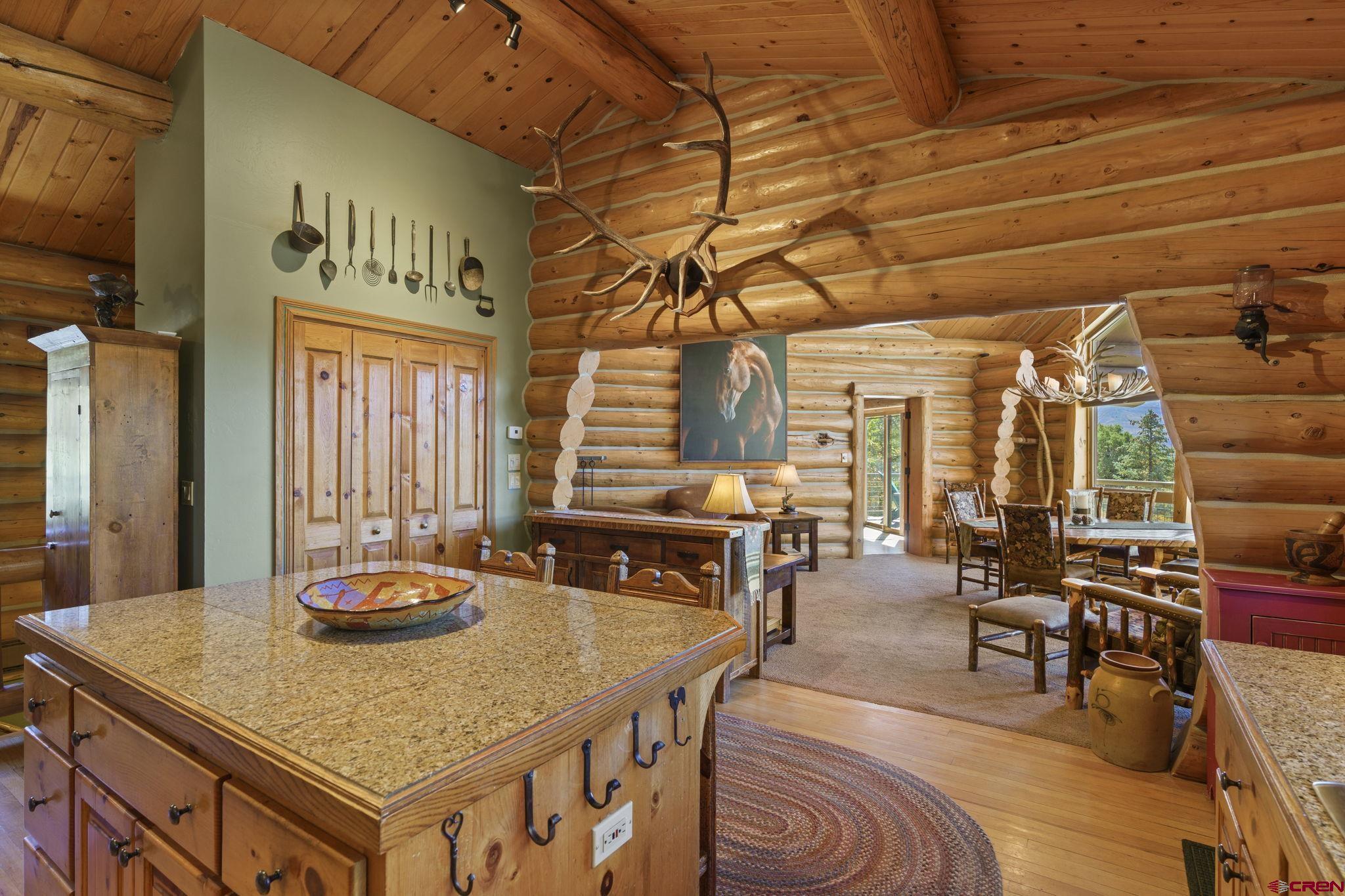 114 Rimrock Drive Durango, CO 81301 - Photo 11 of 42 a dining table with chairs and wooden floor