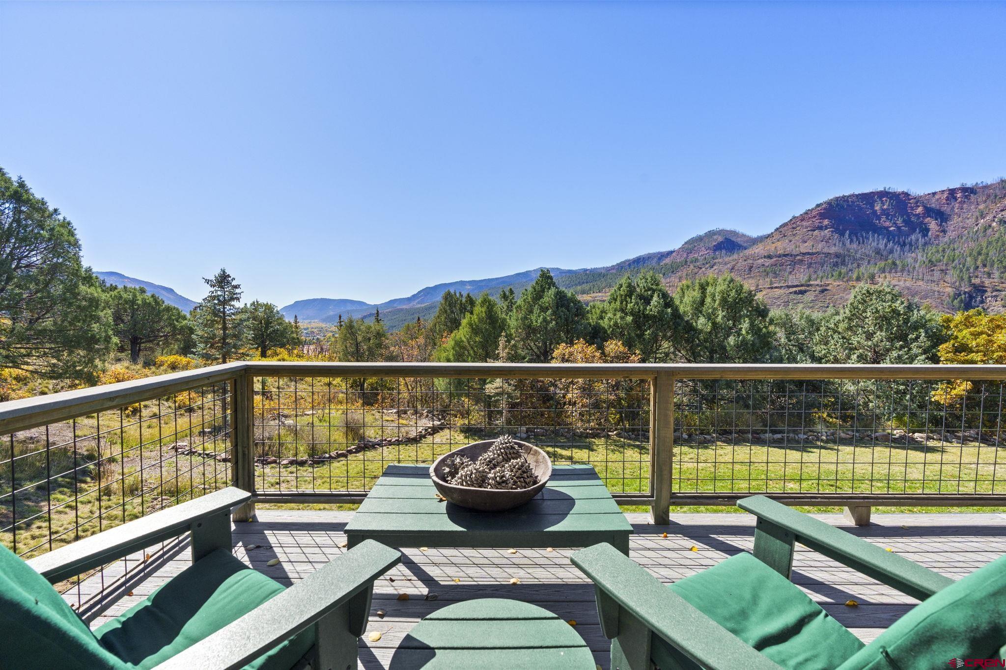 114 Rimrock Drive Durango, CO 81301 - Photo 13 of 42 a view of a balcony with two chairs and a table