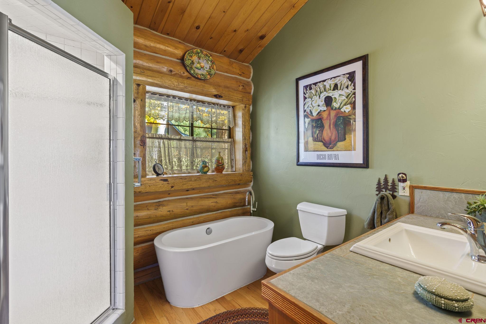 114 Rimrock Drive Durango, CO 81301 - Photo 15 of 42 a bathroom with a sink and a mirror