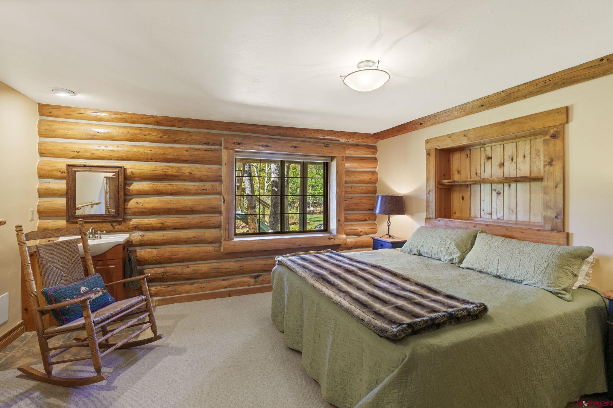 114 Rimrock Drive Durango, CO 81301 - Photo 19 of 42 a bedroom with a bed and a window