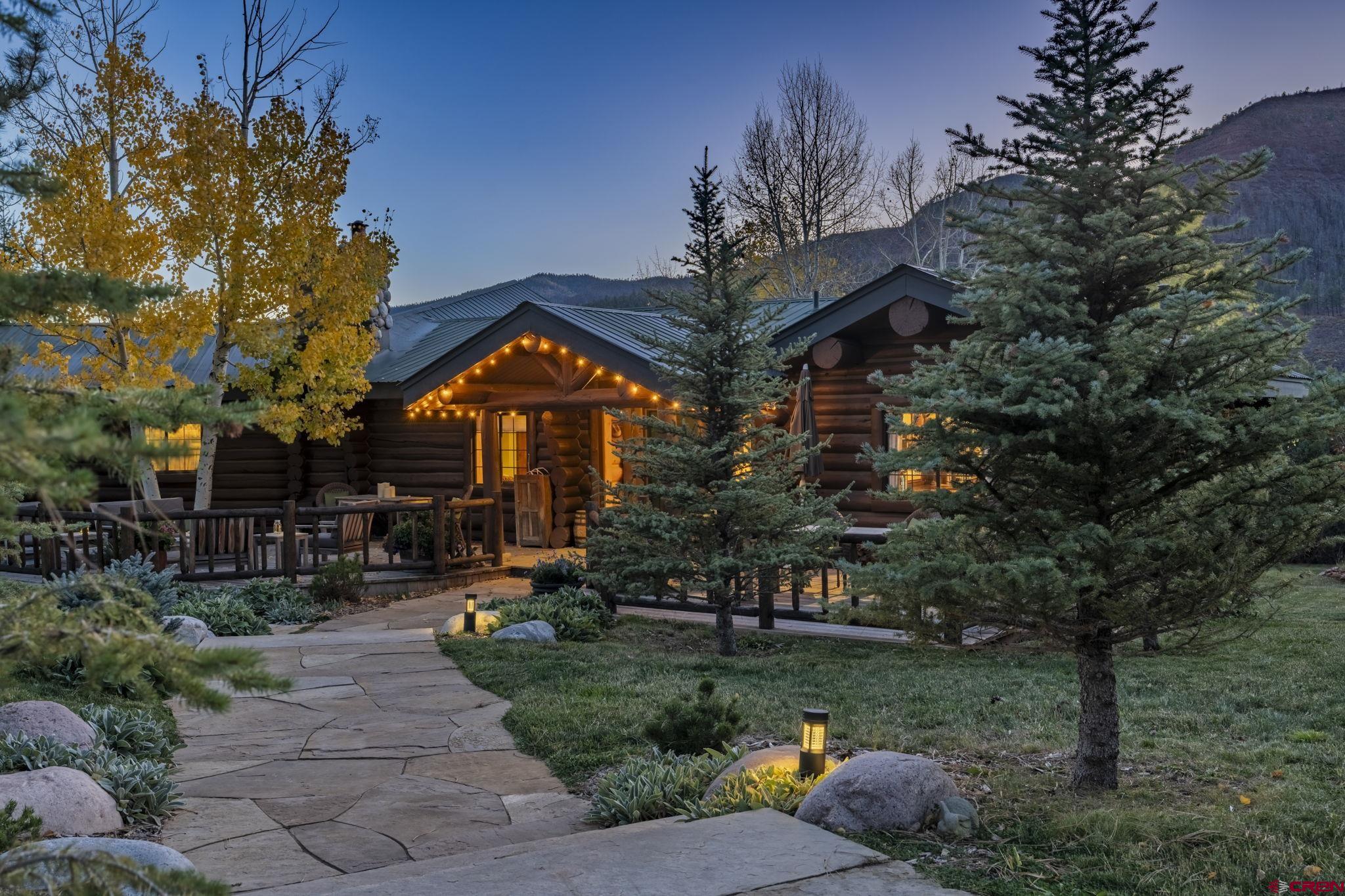 114 Rimrock Drive Durango, CO 81301 - Photo 2 of 42 a front view of a house with a yard