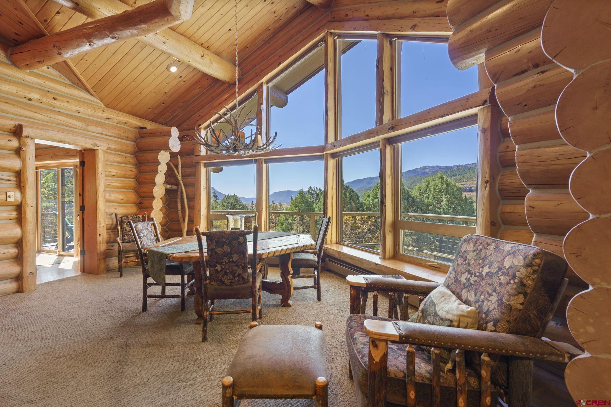 114 Rimrock Drive Durango, CO 81301 - Photo 4 of 42 a dining room with furniture water view and large windows