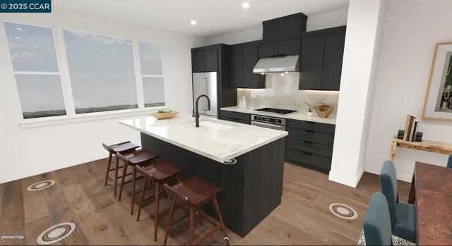 a kitchen with a sink a stove and chairs